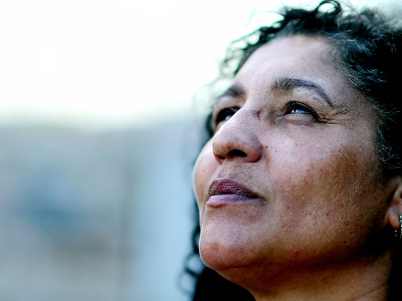 Woman looking upward, off camera