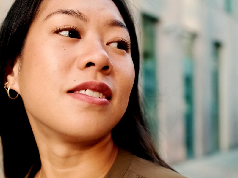Woman looking over her shoulder off camera