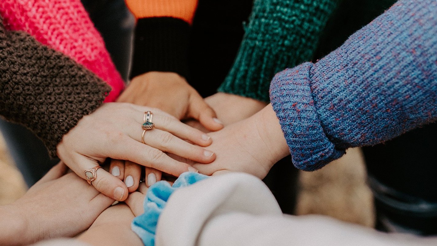 Closeup of a “hand-in” group gesture