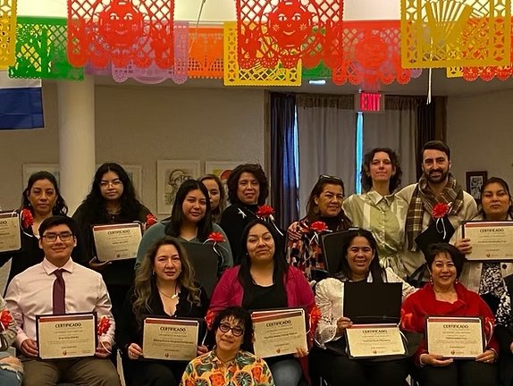 Group of people holding diplomas