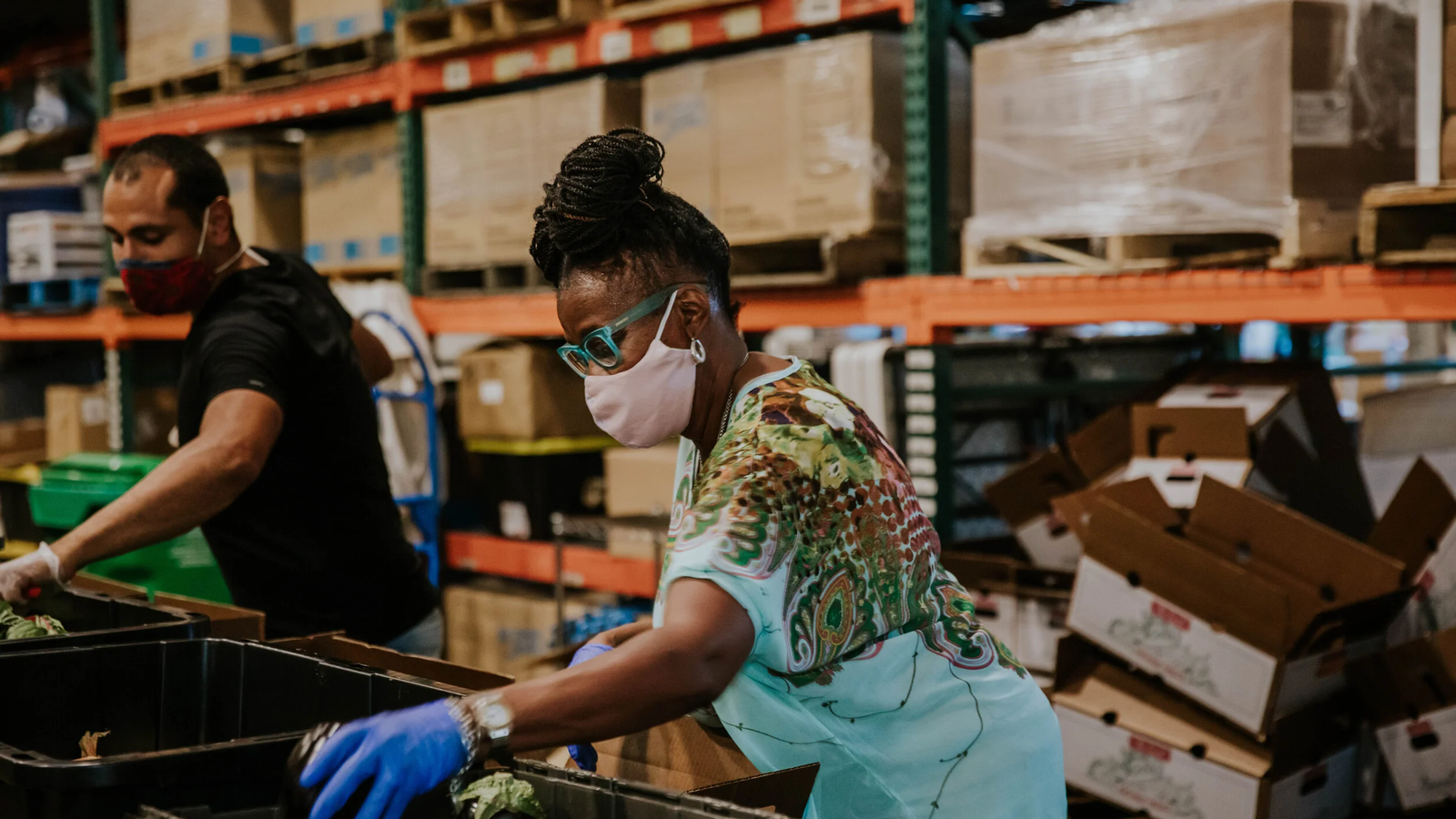 Equitable Giving Circle: volunteers packing boxes at a warehouse