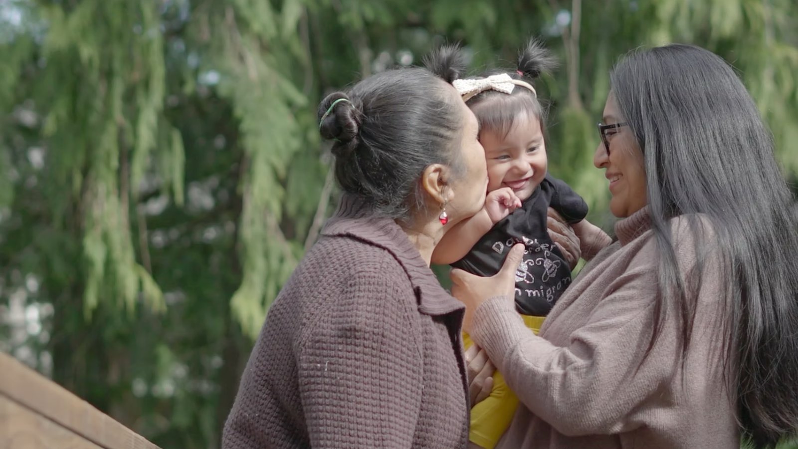Two Latina women and baby