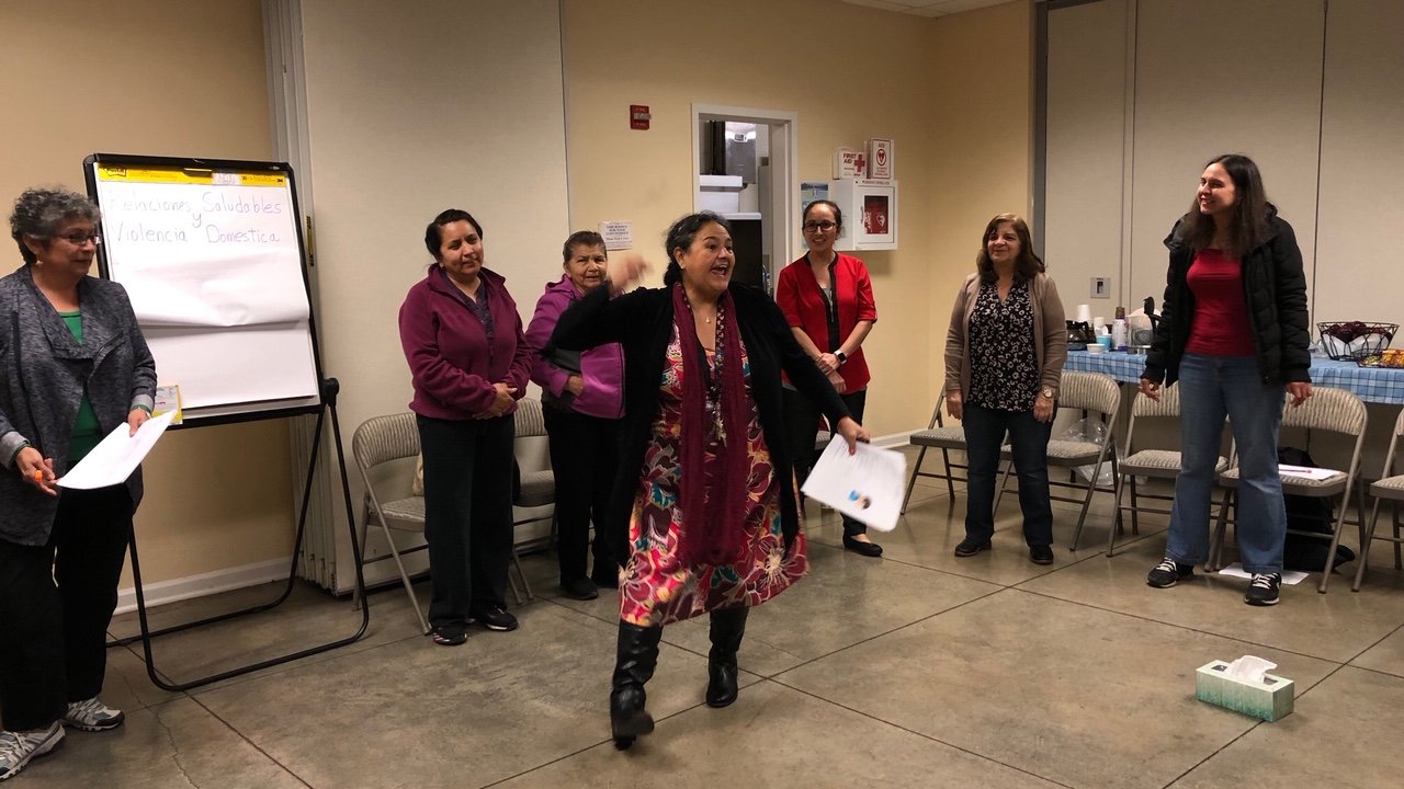 Participants at a group meeting for Raíces de Bienestar