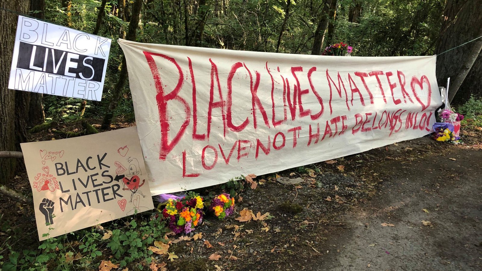 BLM banners in a forest